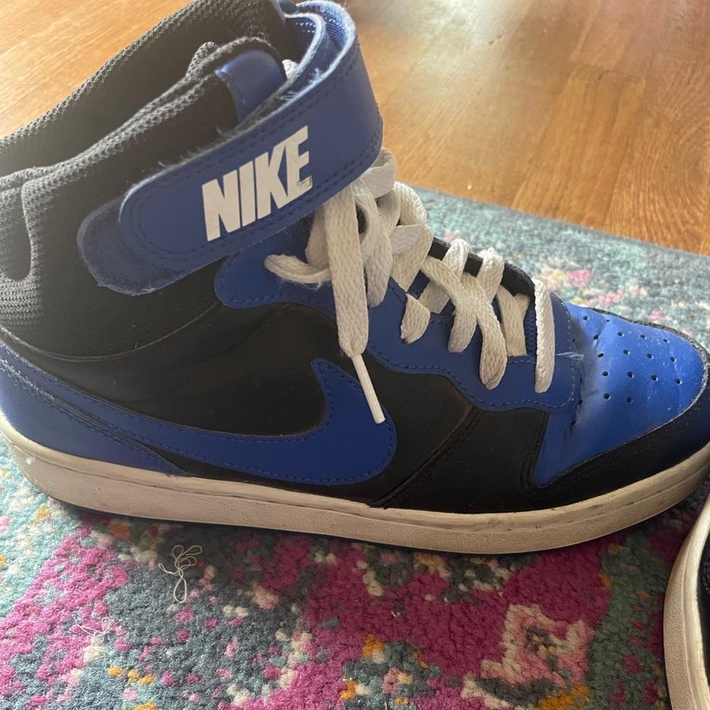 Nike blue and black high tops. Size 6Y but wears like a women’s 8.